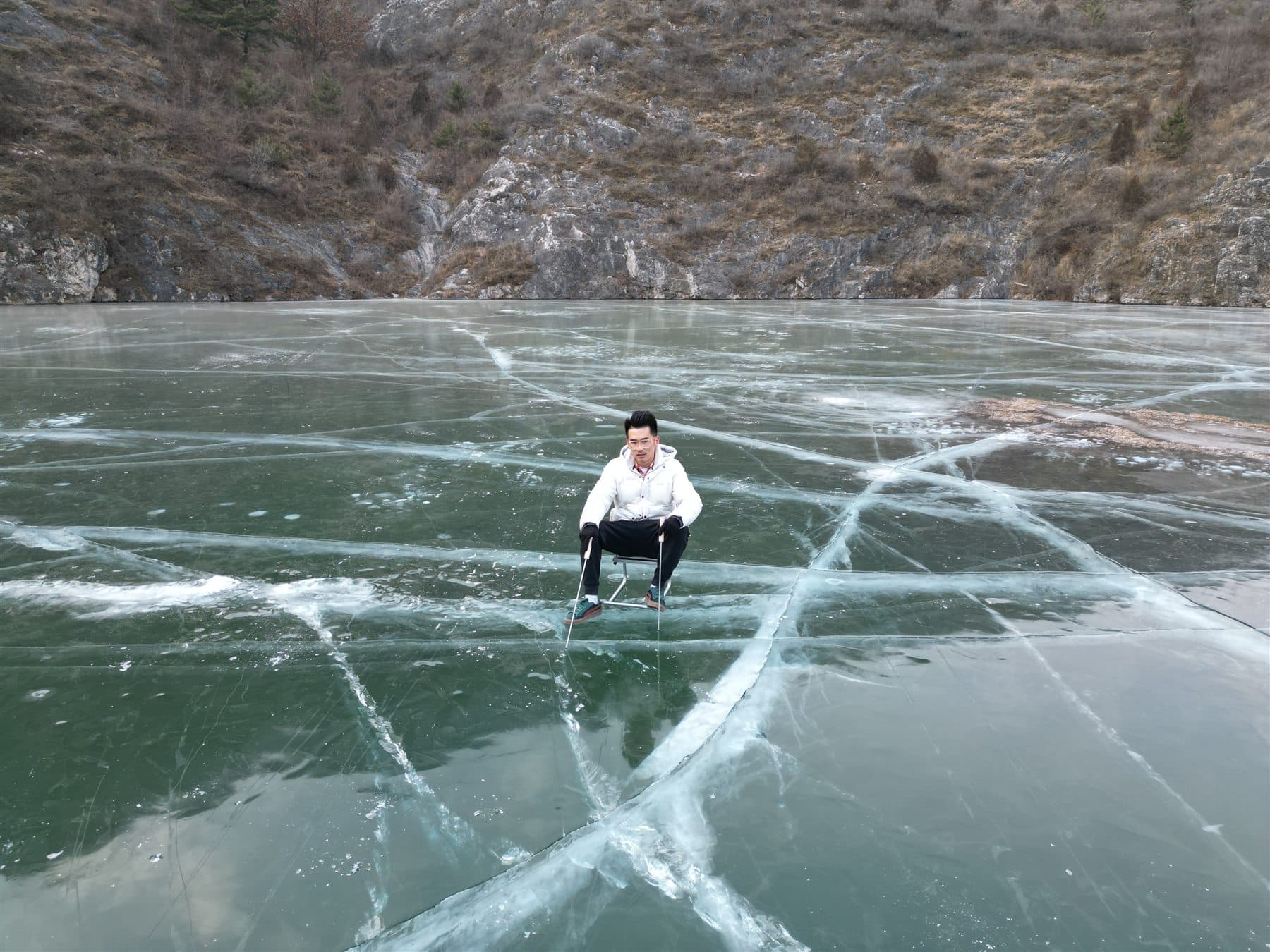 Person standing on a frozen lake